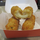 Image for article titled Fast-Food Smackdown: McDonald's Mozzarella Sticks Vs. Wendy's Bacon Fondue Fries